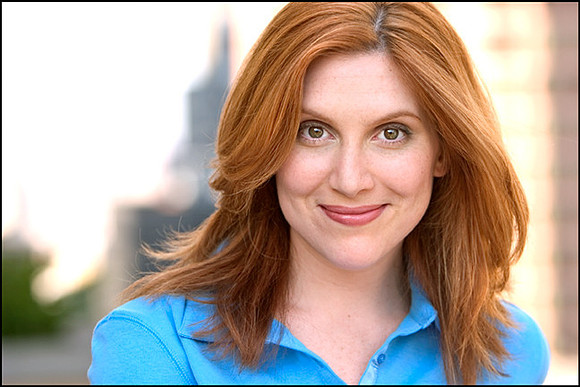 Confident, creative headshot with NYC skyline in background