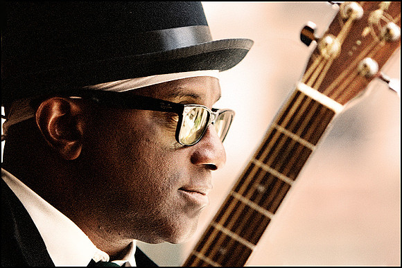 Darryl Milton — Editorial portrait, jazz guitarist captured in warm tones, NYC