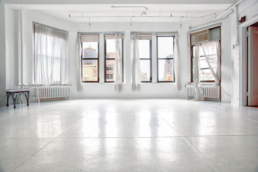Chelsea natural light photo studio with southern exposure, white floors, large windows, and open space for portraits and small shoots
