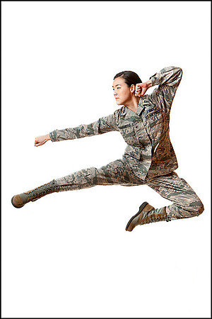 NYC character headshot of woman in military uniform jumping mid-air, strong and energetic