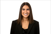 Headshot of woman in blazer on a clean white background.