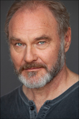 NYC actor headshot of mature man with beard, confident and distinguished for theatrical casting.