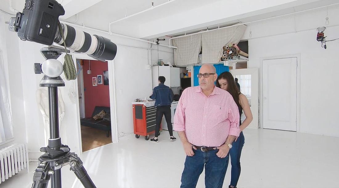 Rod Goodman photographing a client with makeup artist in Chelsea NYC photo studio